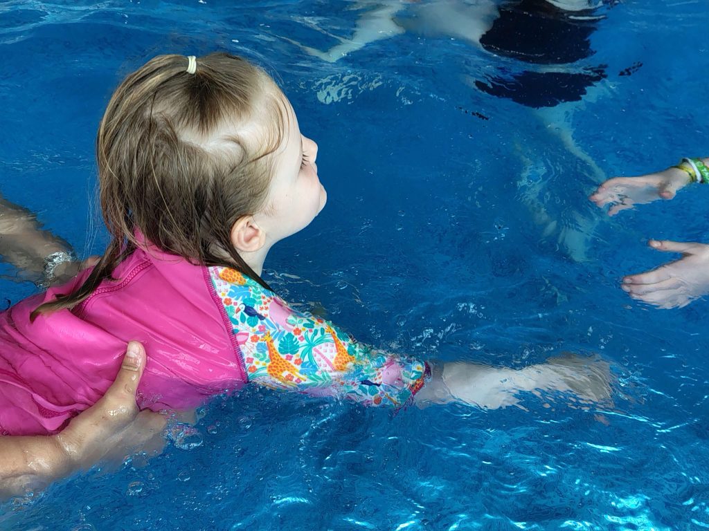 Toddler in swimming pool